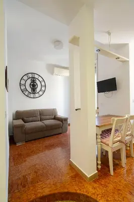 a living room with a couch and a table at Sognando Vacanze Romane in Rome