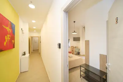 a hallway leading to a bedroom with a bed at Domus Equi in Rome