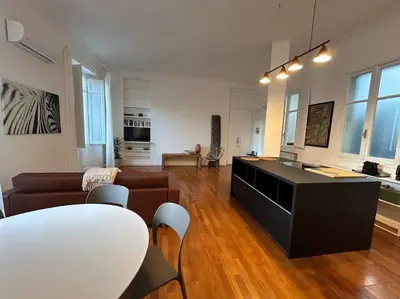 a living room with a couch and a table at Your nest at Colosseum!! in Rome