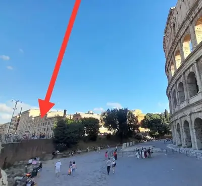 a red arrow is shown in front of the coliseum at Your nest at Colosseum!! in Rome