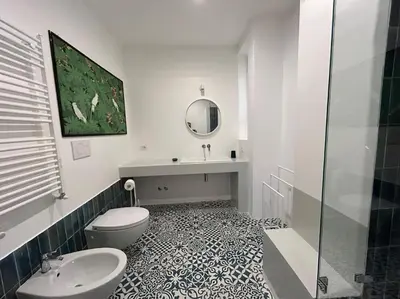 a bathroom with a toilet and a sink and a mirror at Your nest at Colosseum!! in Rome