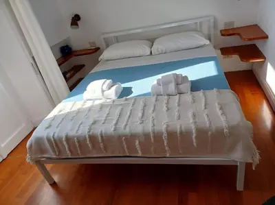 a bed with two stuffed animals on top of it at Your nest at Colosseum!! in Rome