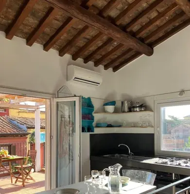 a kitchen with a table with glasses on it at Amazing Terrace in Trastevere in Rome