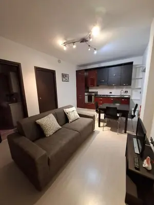 a living room with a couch and a piano at APPARTAMENTO ROMAntica House in Rome