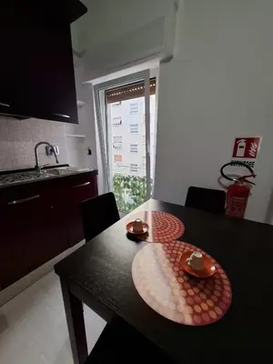 a living room with a couch and a table at APPARTAMENTO ROMAntica House in Rome