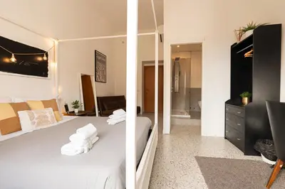 two pictures of a bedroom with a bed and a bathroom at Central Rooms - Vatican in Rome