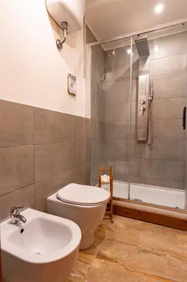 a bathroom with a toilet and a sink and a shower at Central Rooms - Vatican in Rome