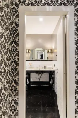 a bathroom with a sink and a mirror at Dimora Colosseum Luxe - Jacuzzi & Private Patio in Rome