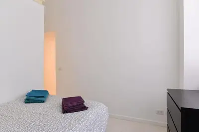 two towels sitting on a bed in a room at Rome City Center loft - special offer in Rome