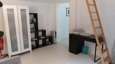 a room with a ladder and a desk and a mirror at Rome City Center loft - special offer in Rome
