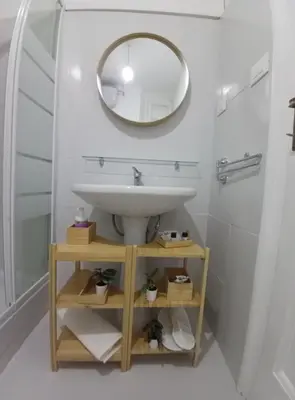 a bathroom with a sink and a mirror at Casa dei Vicoli, Classic Roman apartment in Rome