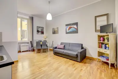 a living room with a couch and a table at Colosseo Families and Groups 2BDR Home and More in Rome