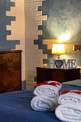 a bedroom with a bed with towels on it at L'Angolo di Roma in Rome
