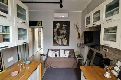 a small room with a bed and a table in it at Art Gallery House, San Giovanni, Roma Centro - Wifi AC Smart TV in Rome