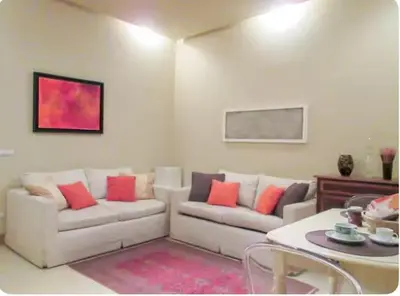 a living room with a couch and a table at Carrozze Suite in Rome
