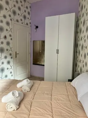 a bedroom with two towels sitting on a bed at CasaPigneto34 in Rome