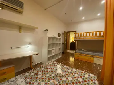 a bedroom with two bunk beds and a bed at La Casa oltre il Parco in Rome