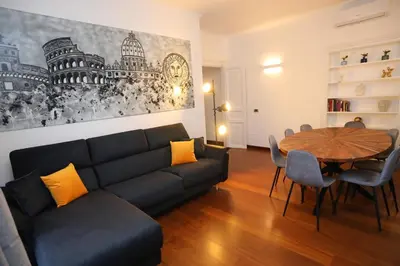 a living room with a couch and a table at Prestige Crescenzio in Rome