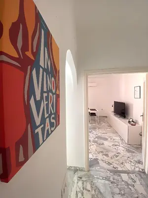 a living room with a painting on the wall at Gregory Retreat in Rome