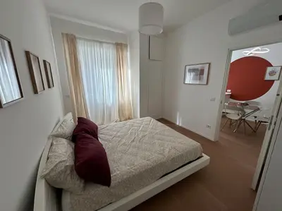 a bedroom with a bed and a table in it at Momenti di serenità a Roma in Rome