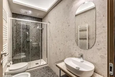 a bathroom with a sink and a shower at Palazzo Ottavia - La Maison D'art Collection in Rome
