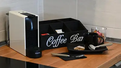 a coffee box sitting on top of a wooden table at Domus Fama in Rome