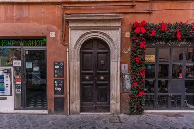 a building with a door and christmas decorations on it at Appartamento del Fico in Rome