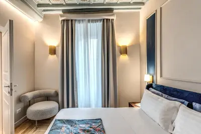 a hotel room with a bed and a window at Appartamento del Fico in Rome