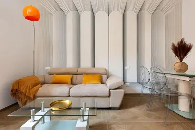 a living room with a couch and a table at Idyllia - Magnificent Central Apartment in Rome