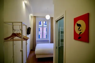 a room with a bedroom with a bed and a window at Maison Almo Guesthouse in Rome