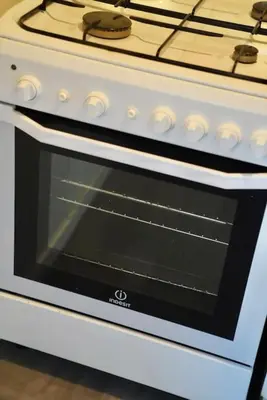 a white stove top oven with an open door at Trastevere Lovely Loft in Rome
