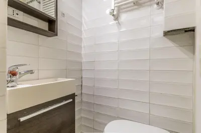 a bathroom with a toilet and a sink at The ancient volute guest house in Rome