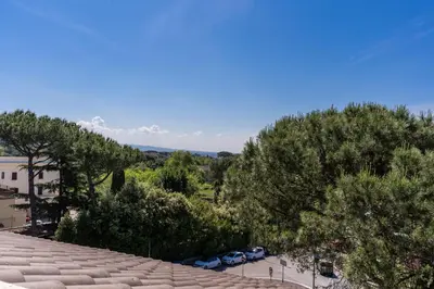 a view from the roof of a building with trees at Romantic Vatican Attic Villa Pamphili in Rome