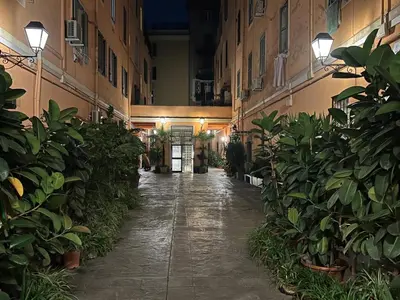an empty hallway of a building with potted plants at Daisy House in Rome