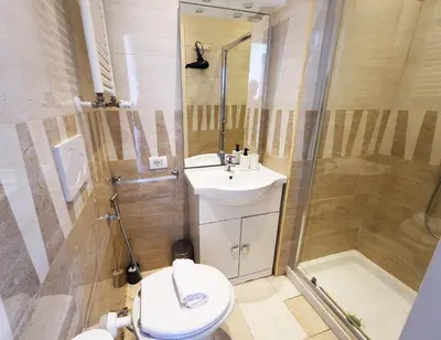 a bathroom with a toilet and a shower and a sink at Key Rome Center in Rome