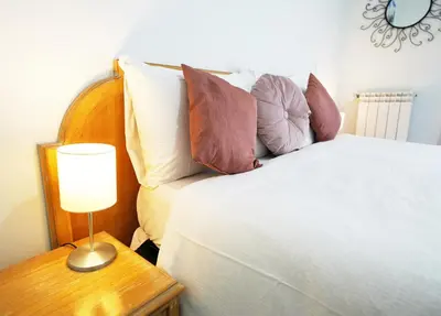a bedroom with a bed and a table with a lamp at Key Rome Center in Rome