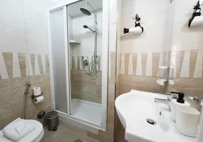 a bathroom with a shower and a sink and a toilet at Key Rome Center in Rome