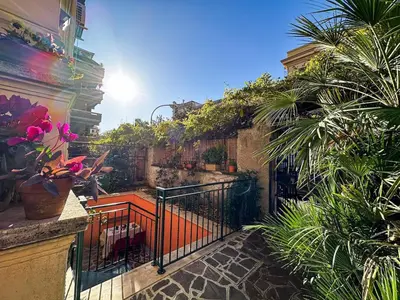 a balcony with a gate and some plants at Alloggio Turistico al Villino del Melograno in Rome