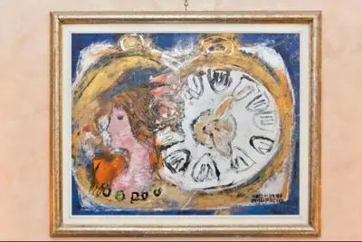 a painting of a woman and a clock on a wall at B&B Classy Rome in Rome