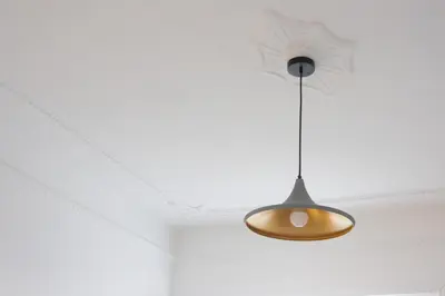 aendant light hanging from a ceiling in a room at Imperia House in Rome