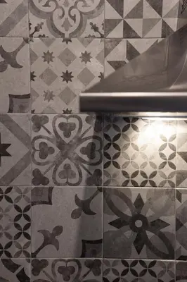a close up of a tile floor with a toilet at Imperia House in Rome