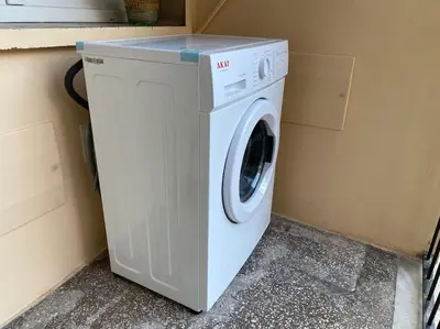 a white washer and dryer sitting next to a wall at Vacanze Romane da Manuela in Rome