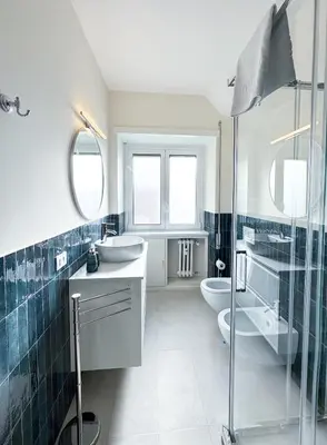 a bathroom with a sink and a toilet and a shower at Vatican Fiore apartment in Rome