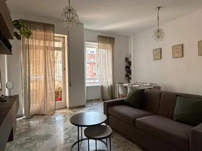a living room with a couch and a table at 5Piano Ascensore Near Vaticano Ideale per Famiglie in Rome