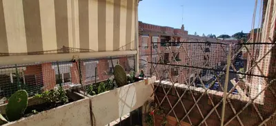 a view of a building with a fence at 5Piano Ascensore Near Vaticano Ideale per Famiglie in Rome
