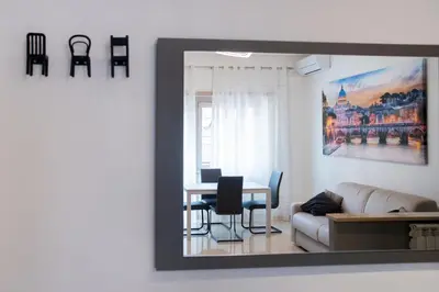 a living room with a table and a couch at Appartamento a 2 passi da San Pietro in Rome