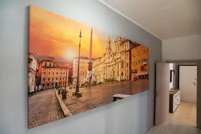 a large painting of a city street with buildings at Appartamento a 2 passi da San Pietro in Rome