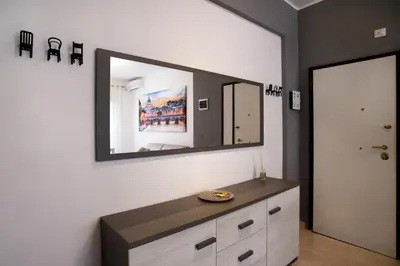 a bathroom with a vanity and a mirror on the wall at Appartamento a 2 passi da San Pietro in Rome
