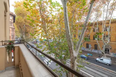 an apartment balcony with a view of a street at Contemporary Flat in Trastevere in Rome