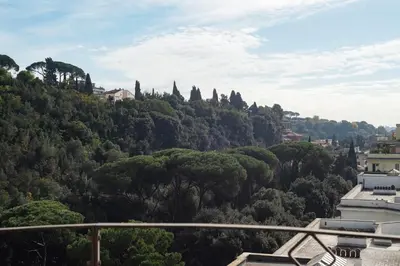 a view of a hill with trees and buildings at GuestHost - Bright and roomy apartment in Flaminio district in Rome